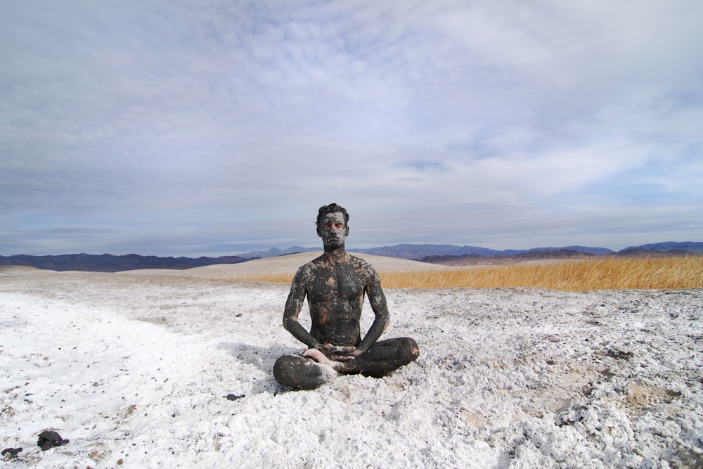 man sitting on shore