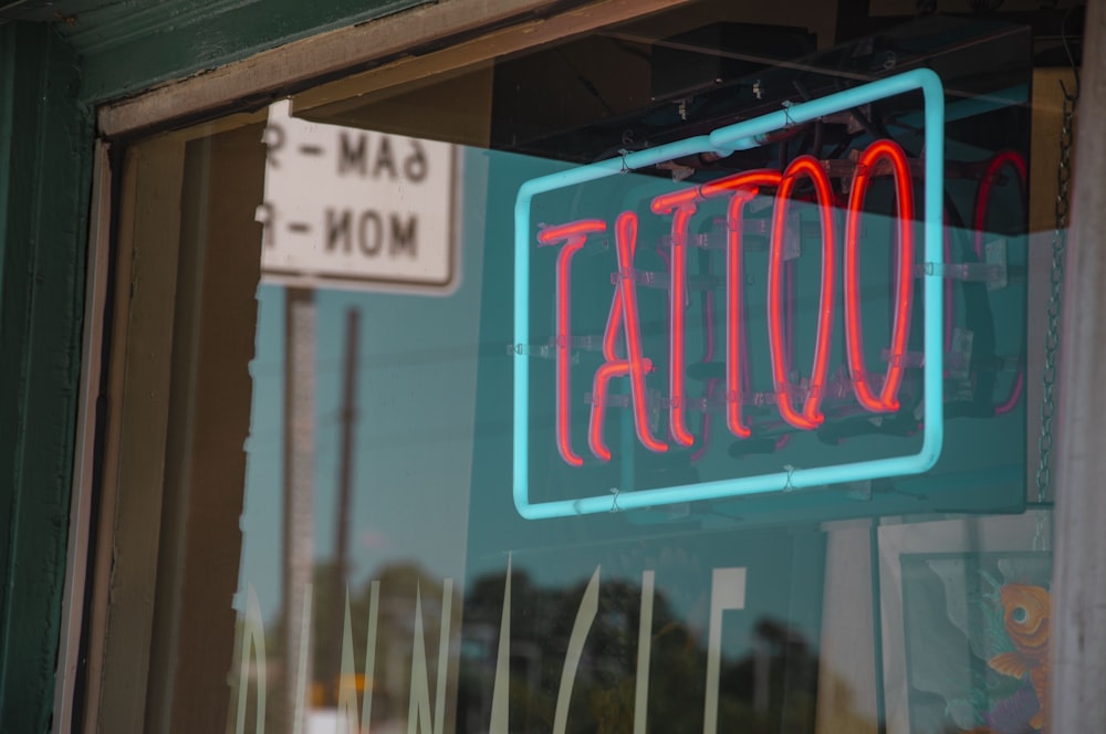 lighted red and green Tattoo neon signage