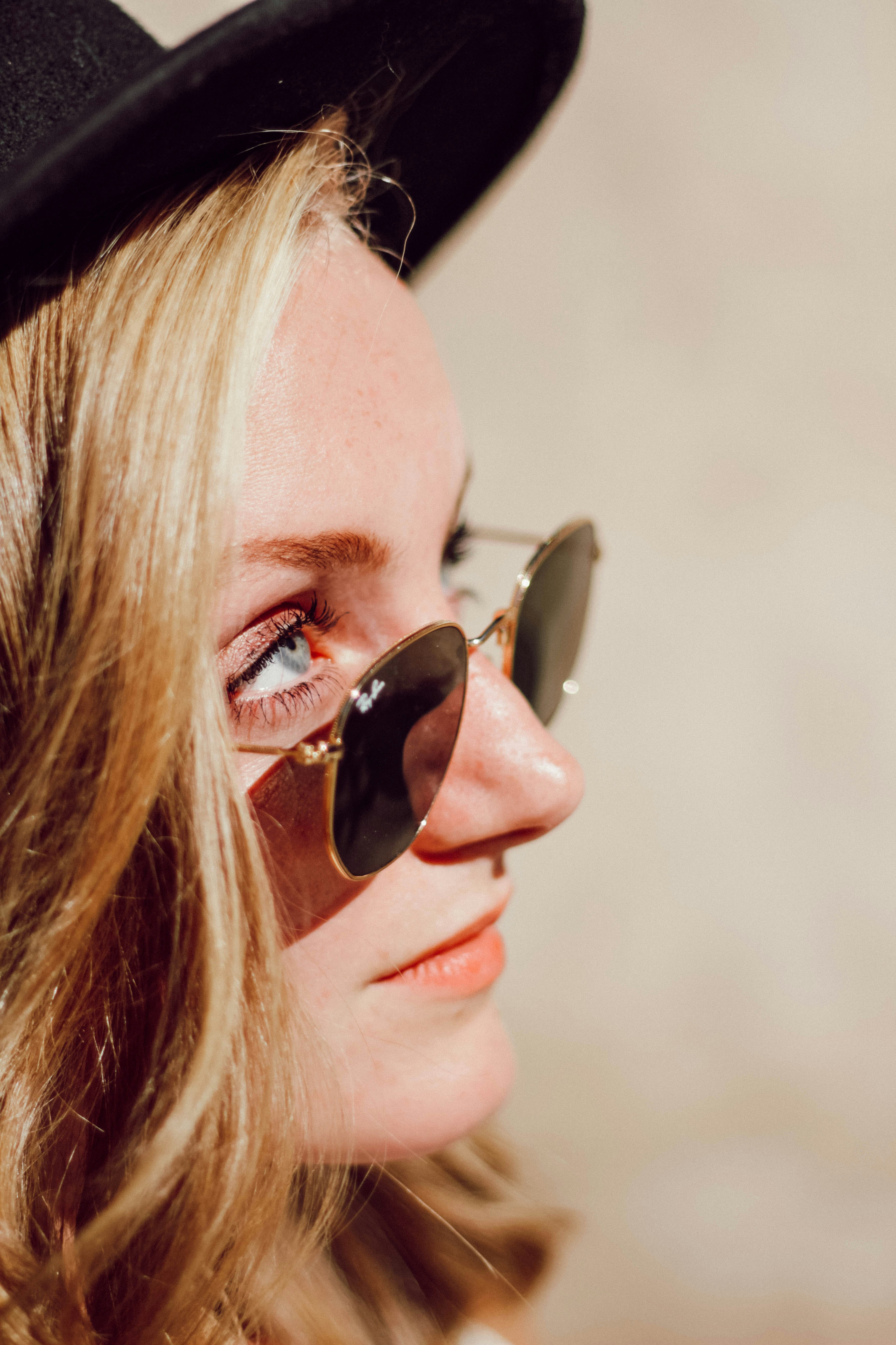 woman in black Ray-Ban sunglasses