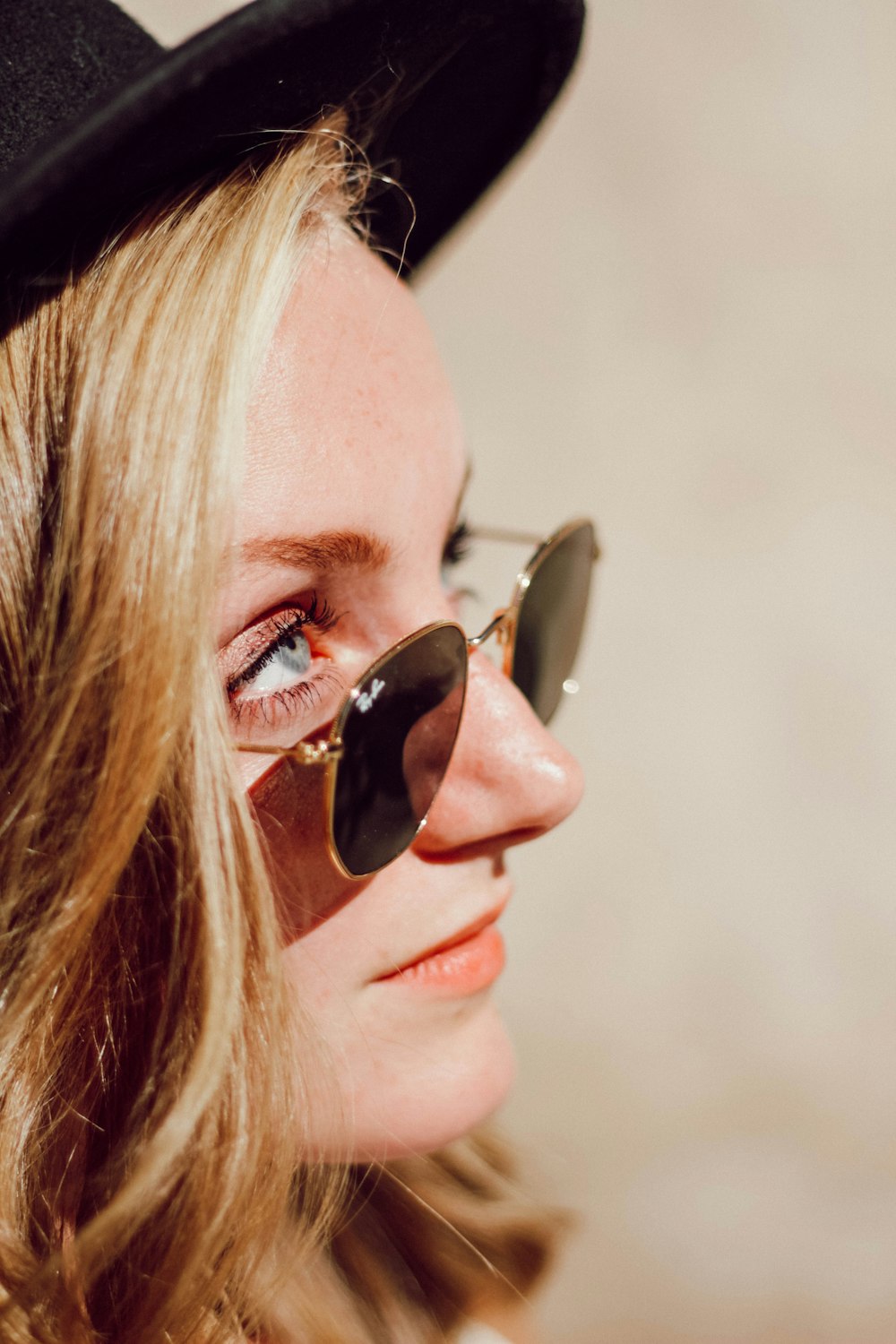 woman in black Ray-Ban sunglasses