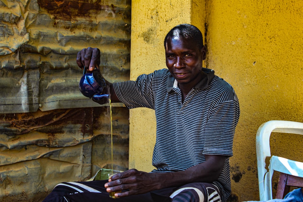 man holding teapot