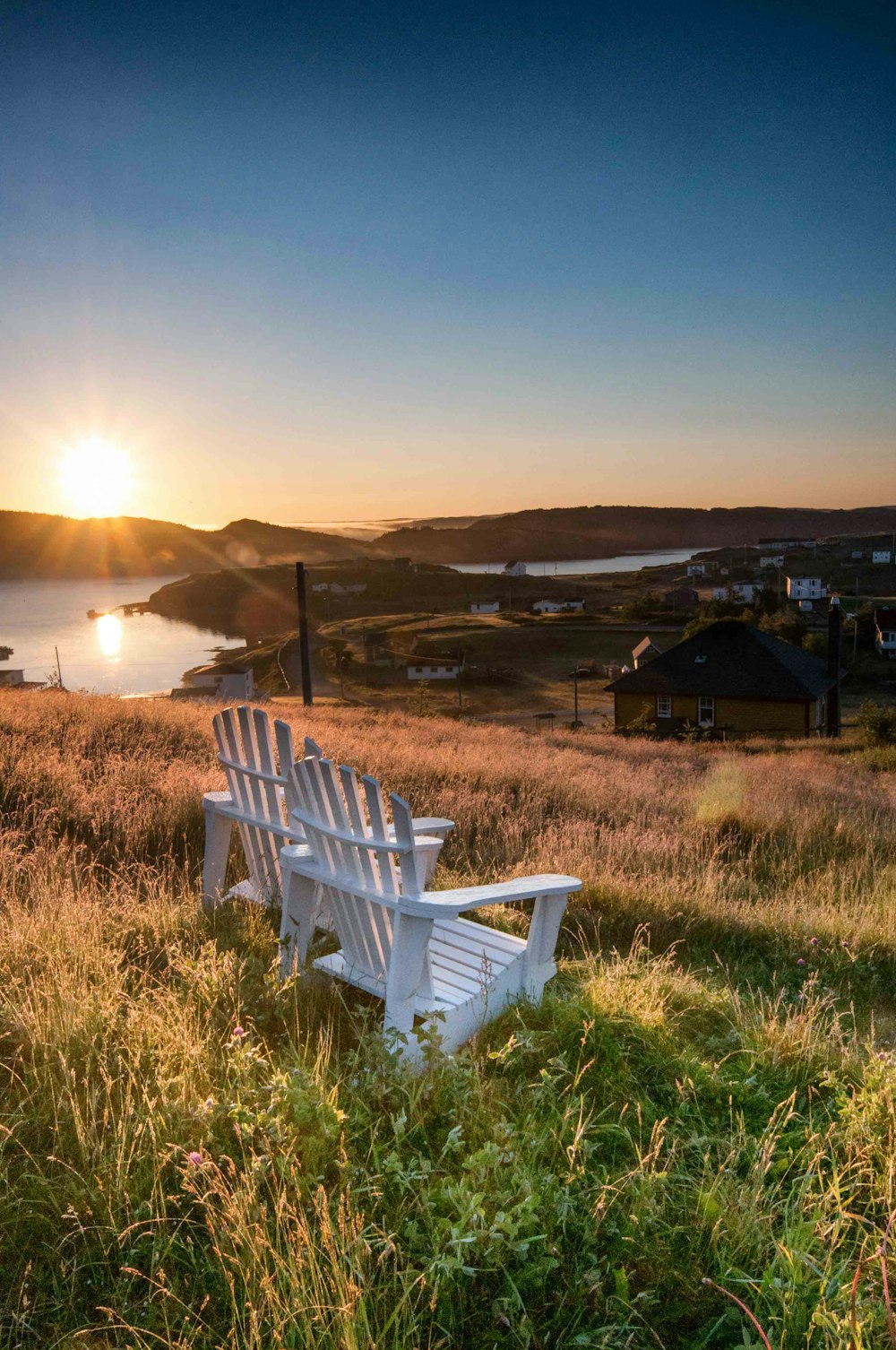 two empty adirondack chairs