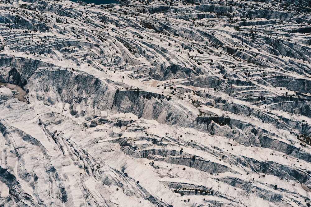 an aerial view of a snow covered mountain