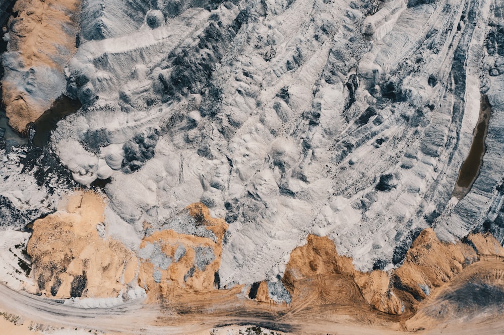 an aerial view of a snow covered mountain