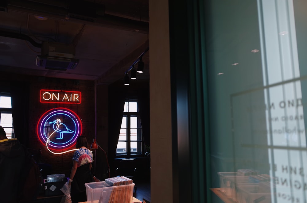 a neon sign on the wall of a restaurant