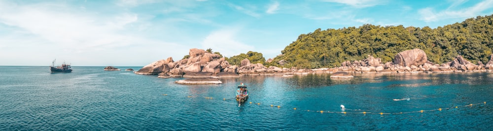 body of water near mountains at daytime