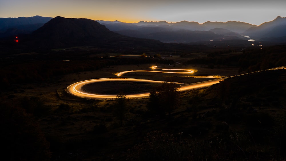 a winding road in the mountains at night