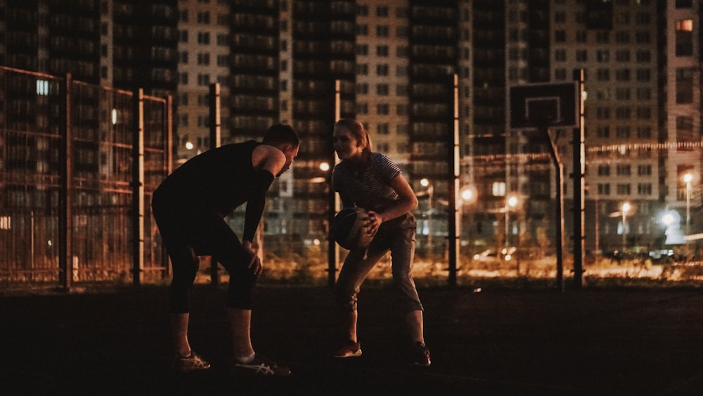 two person playing basketball