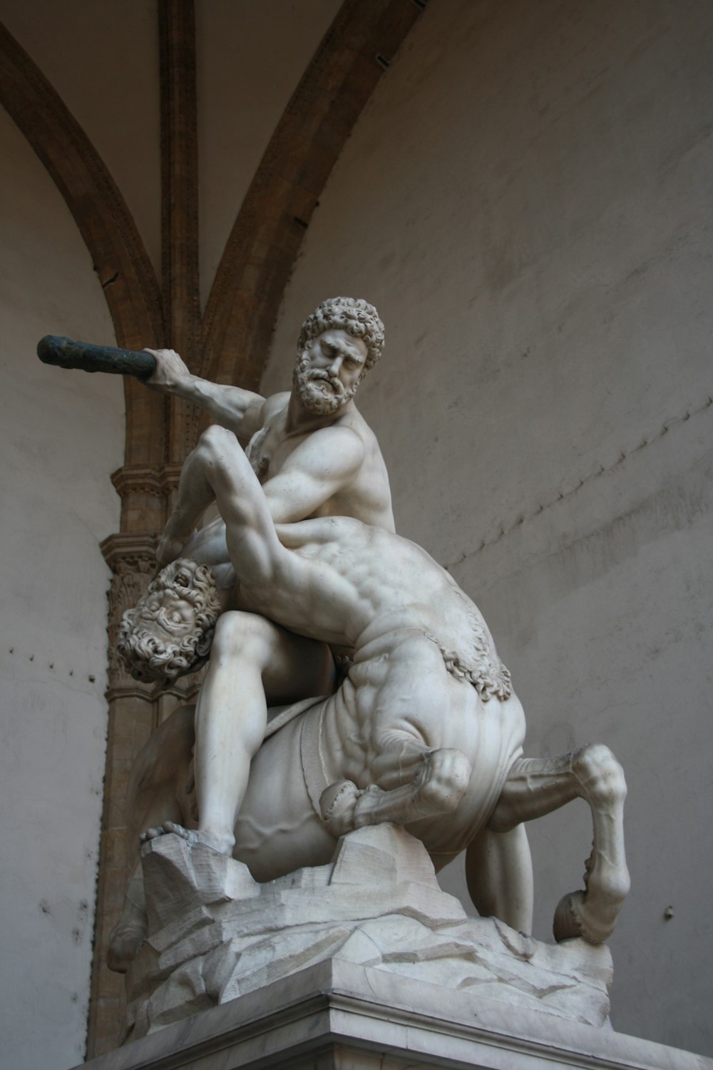 man fighting centaur statue
