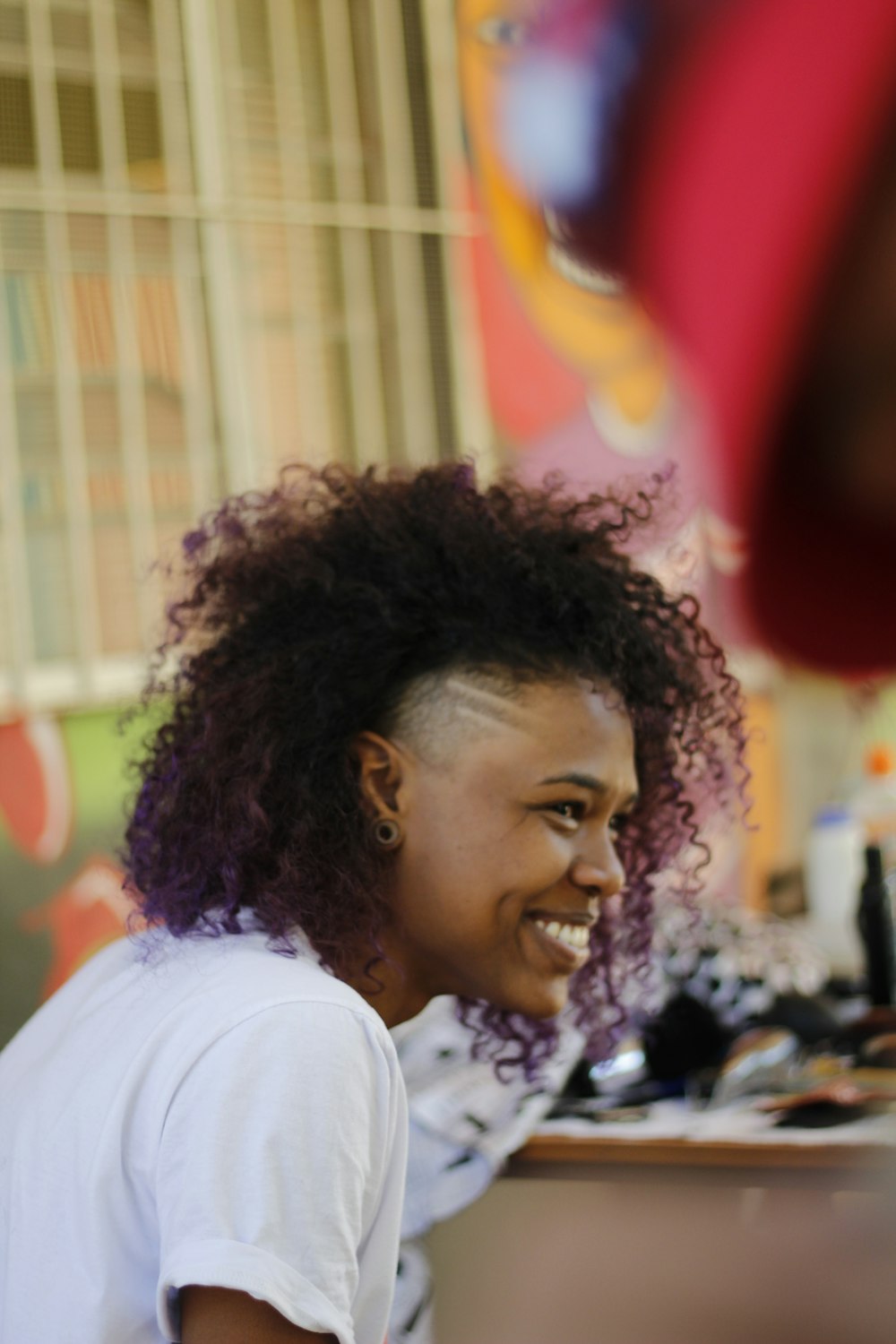 shallow focus photo of woman in white T-shirt