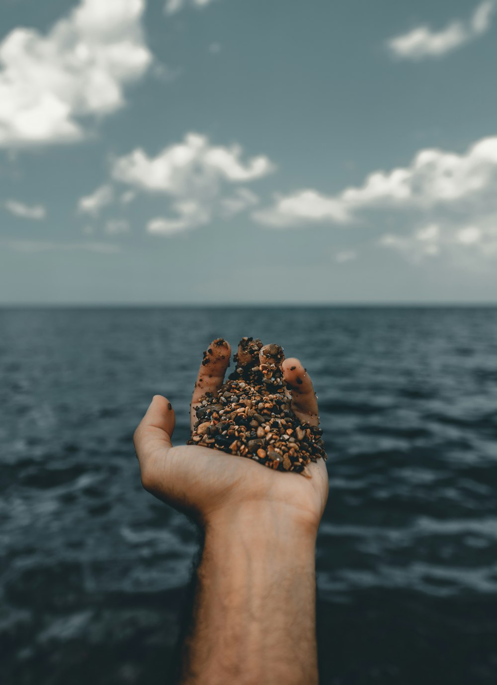 person holding sand