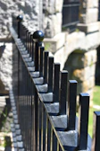 Close-up of a sturdy metal fence with clean lines and a smooth finish, showcasing expert craftsmanship.