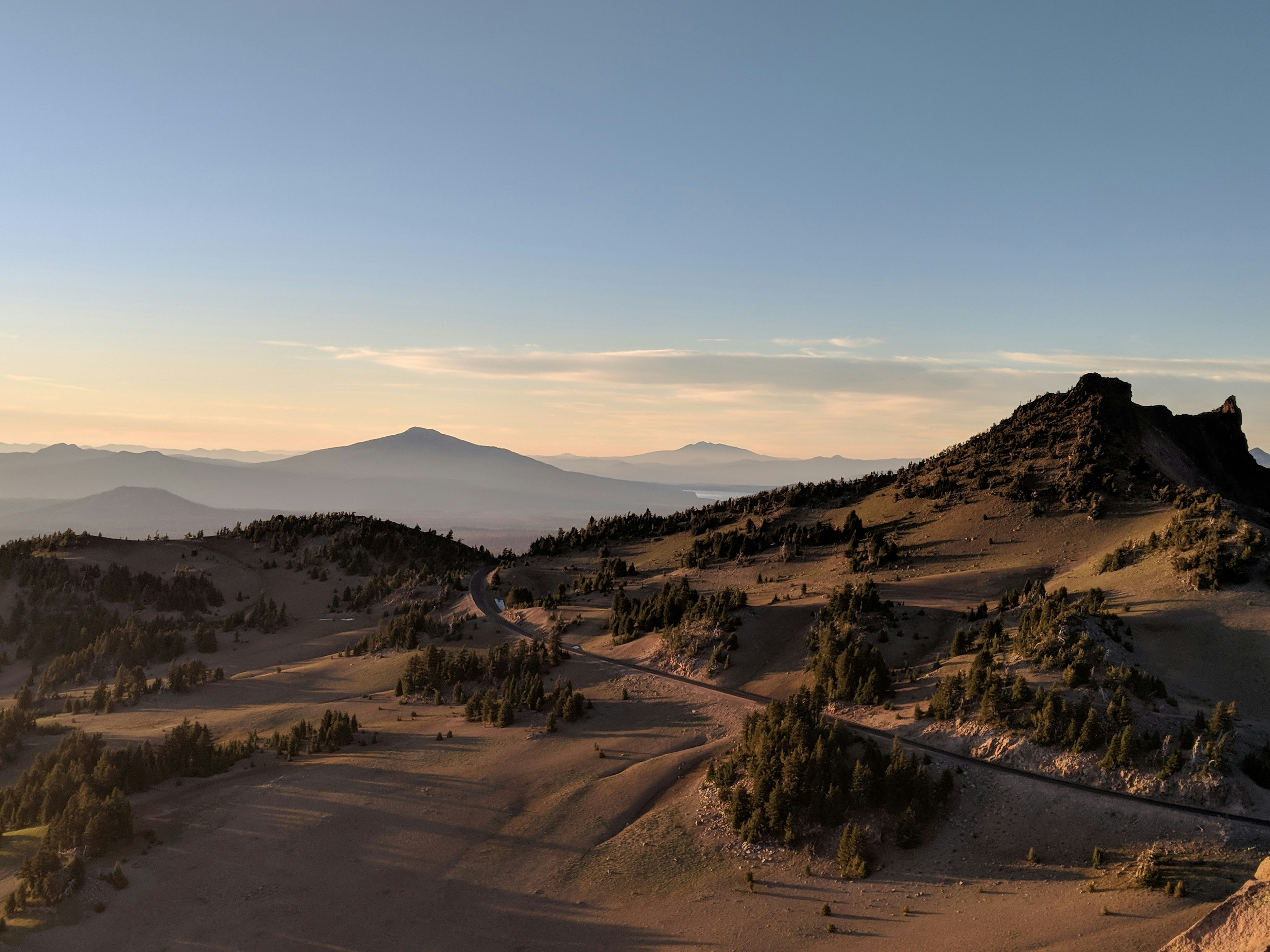 landscape photo of black and brown mountainsby Alex Wolfe