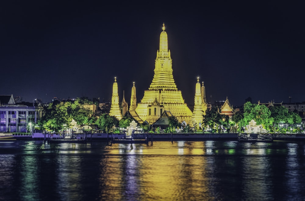 building near body of water at night