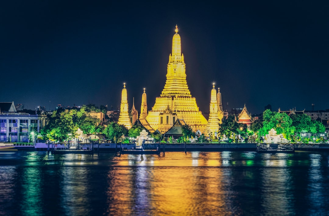 building near body of water at night