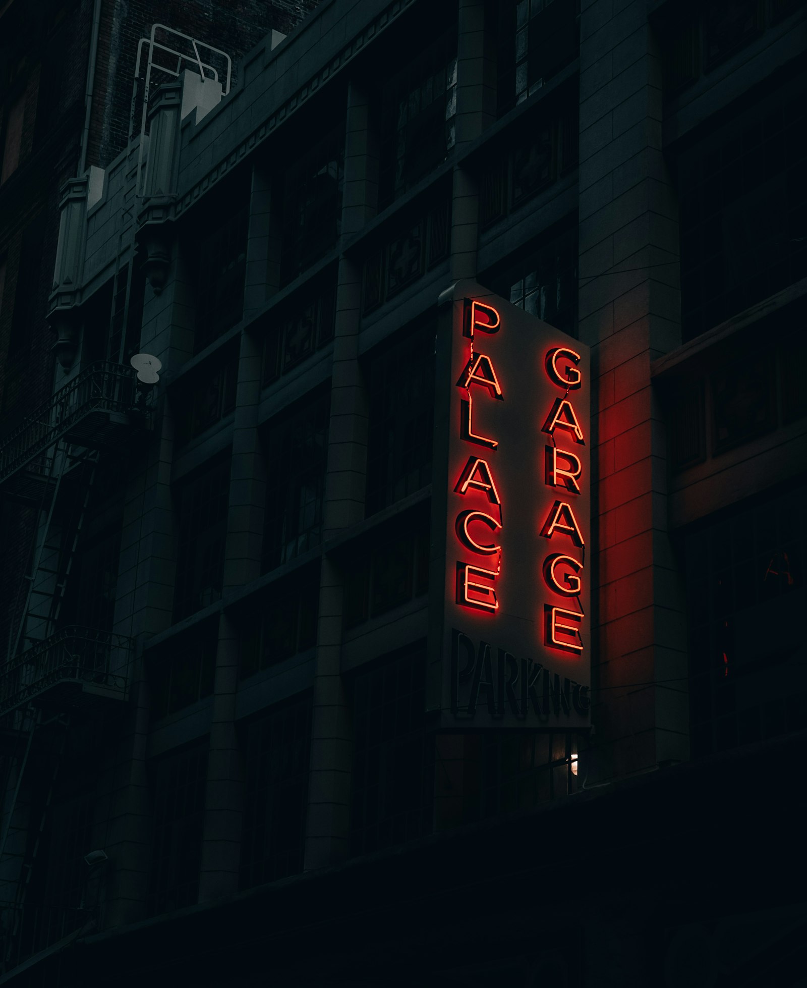 Sony a7 III + Canon 18-35mm F1.8 DC HSM | Art 013 sample photo. Red palace garage neon photography