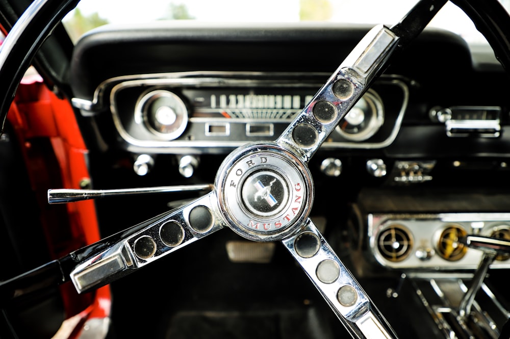 closeup photo of chrome and black Ford Mustang steering wheel