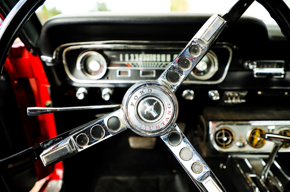 closeup photo of chrome and black Ford Mustang steering wheel