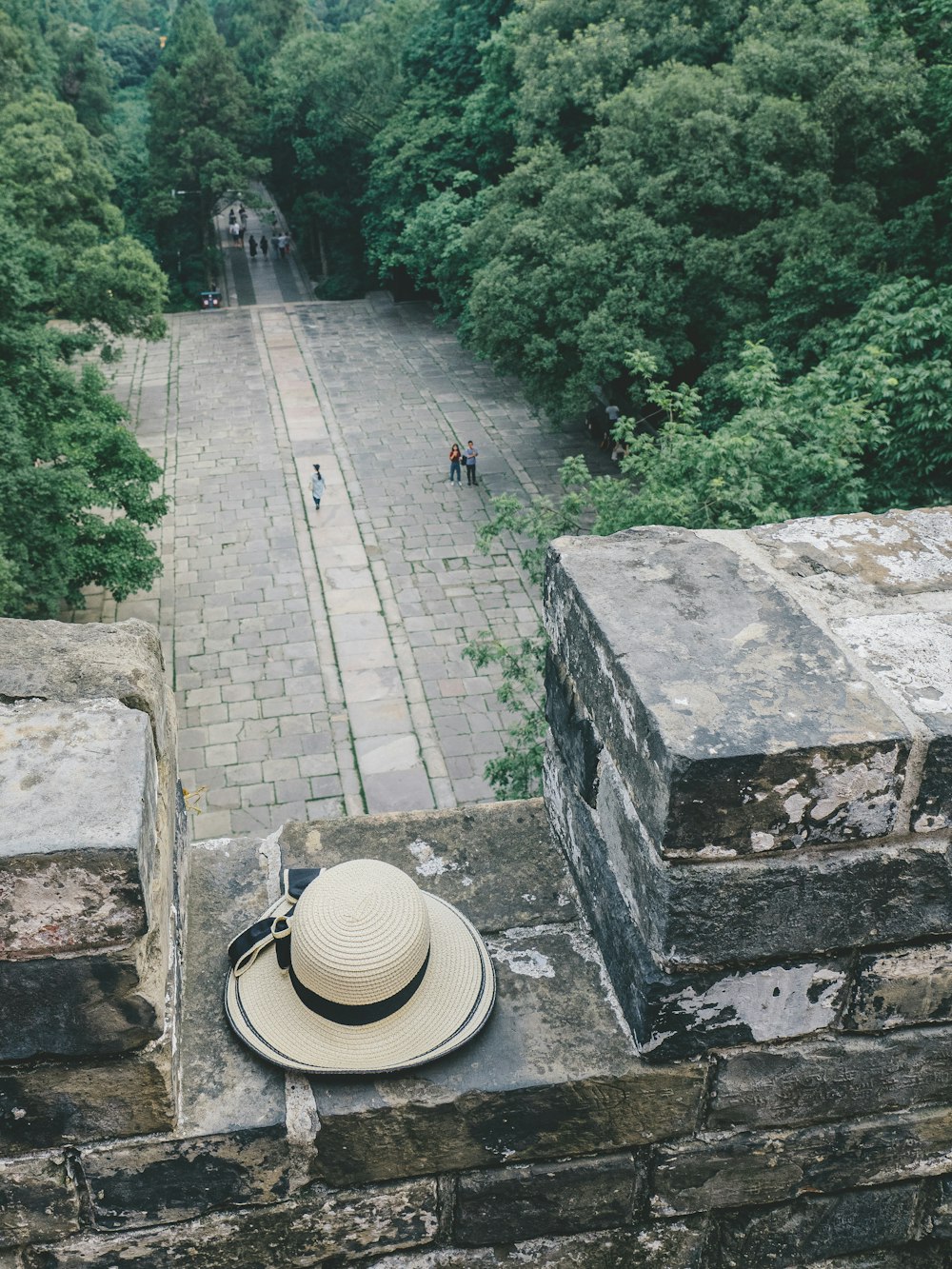 beige hat near road