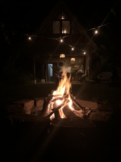 Evening view of Bamedson's cozy cabana with string lights and a relaxed atmosphere