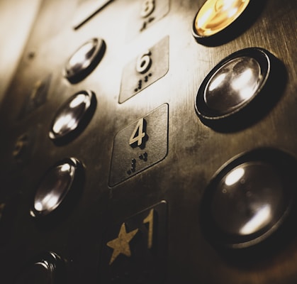 close-up photo of elevator push buttons