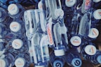 A variety of small water bottles in different colors.