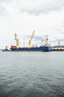 a large blue and white boat in a body of water