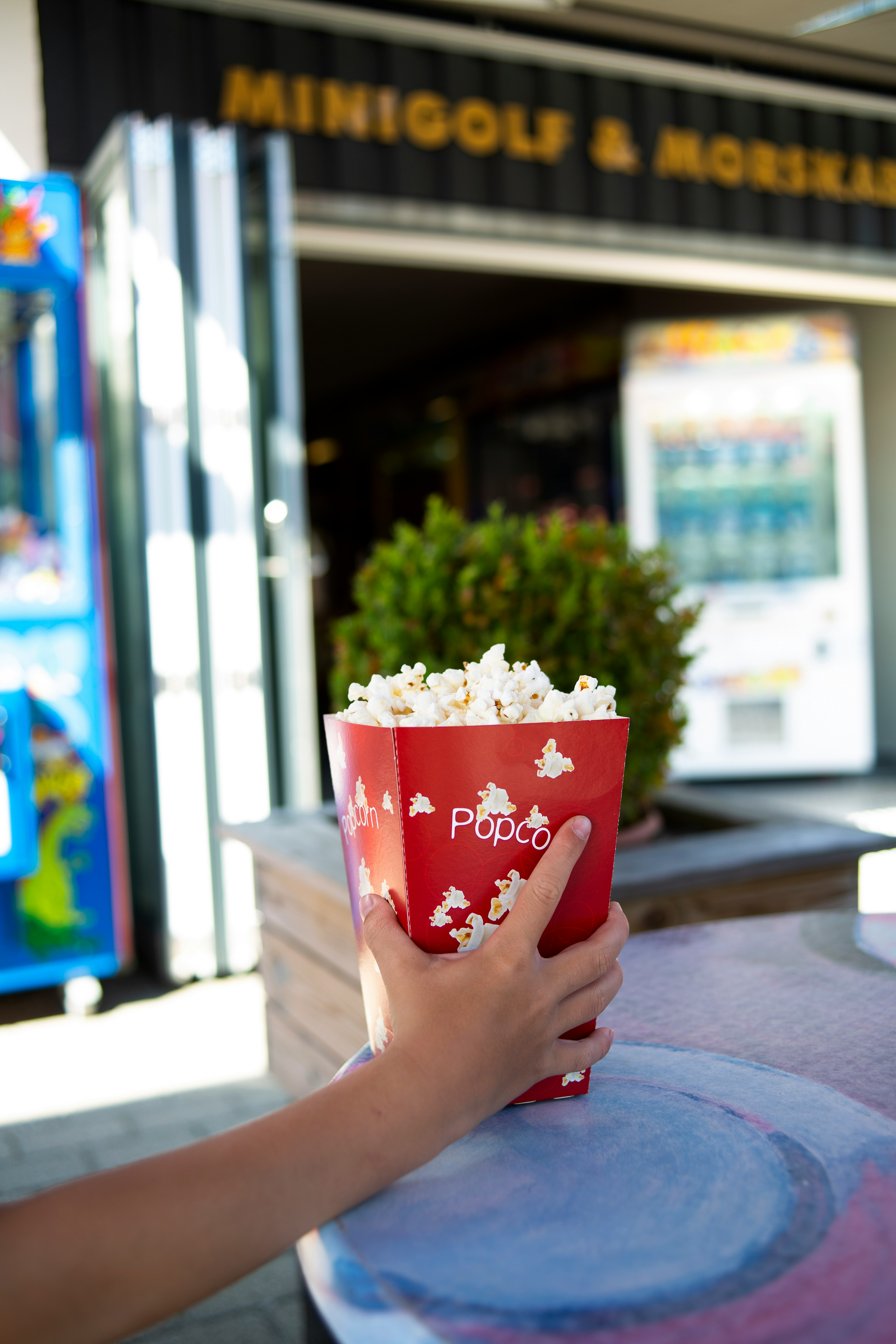 person holding popcorn