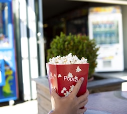 person holding popcorn