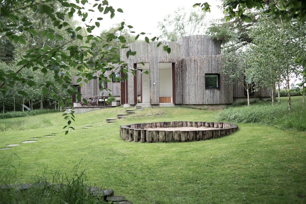 brown wooden house surrounded by trees