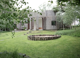 brown wooden house surrounded by trees