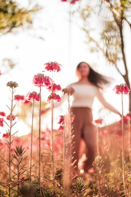 Soft-focus image of a person standing in nature, embodying calm after trauma.