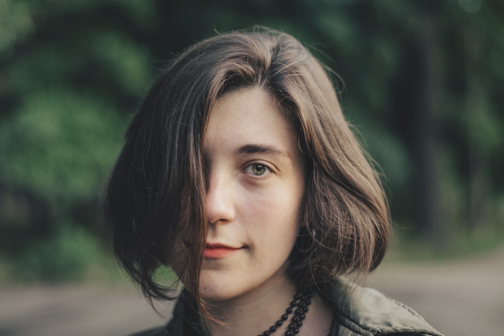 selective focus photography of woman in gray collared top