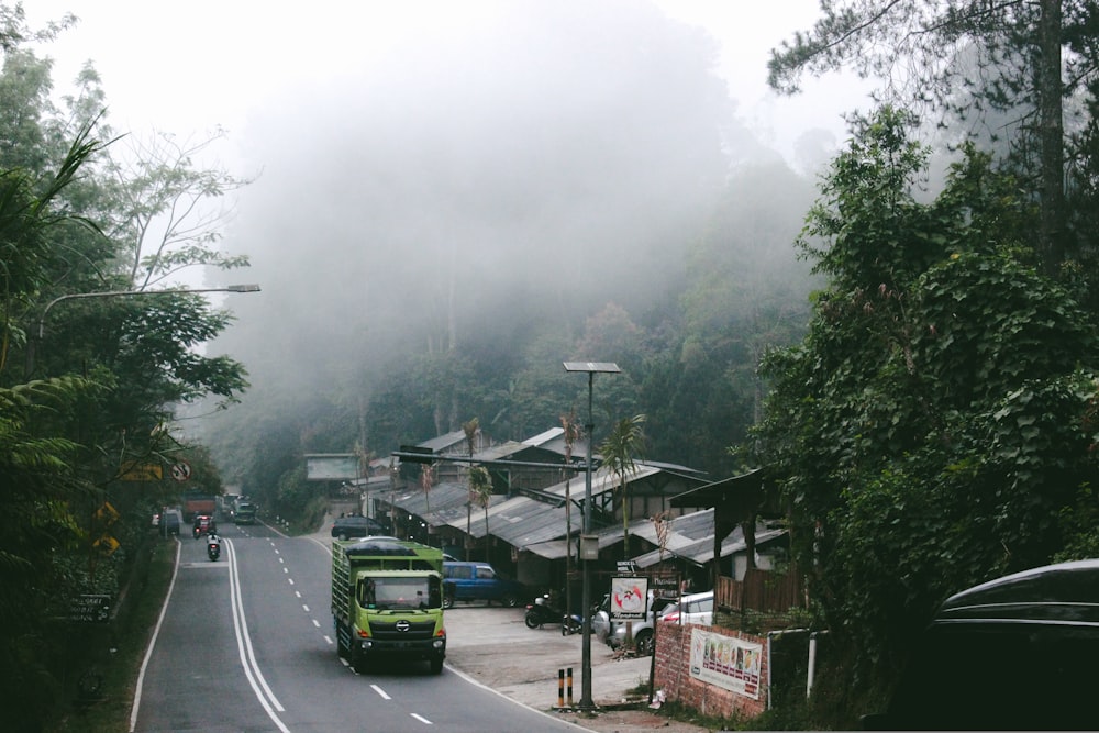 aerial photography of a truck passing by asphalt road