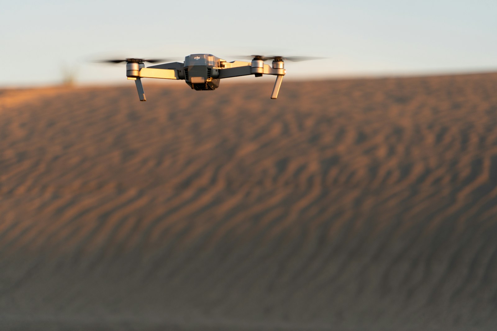 Surveillance drone over desert