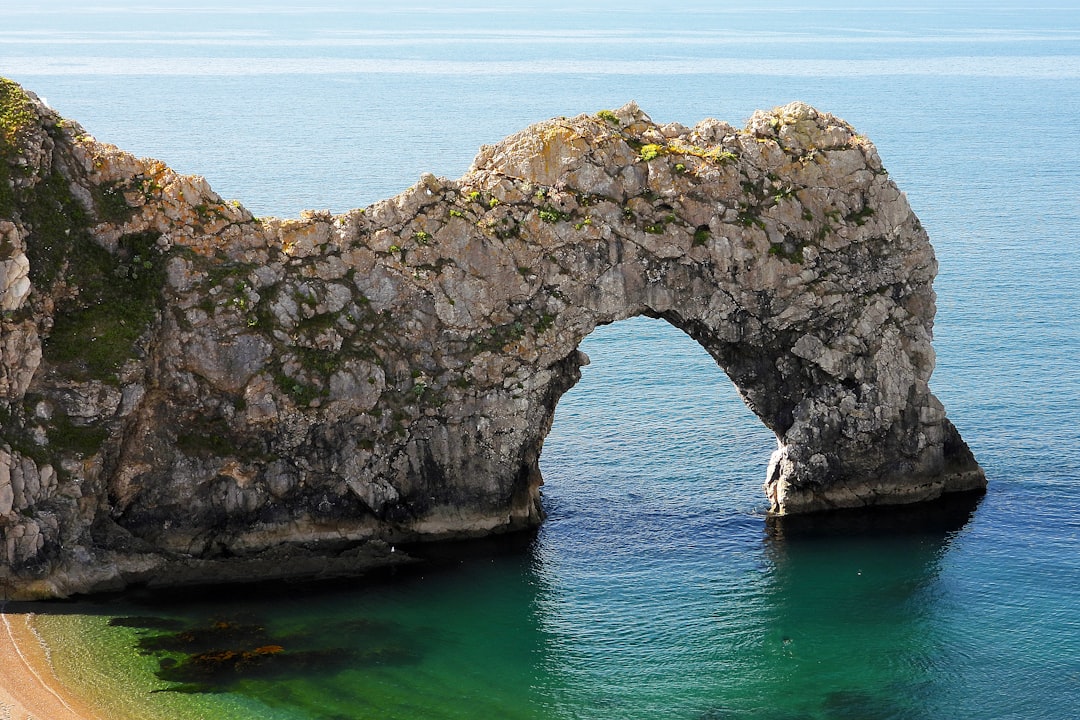 grey cliff on ocean