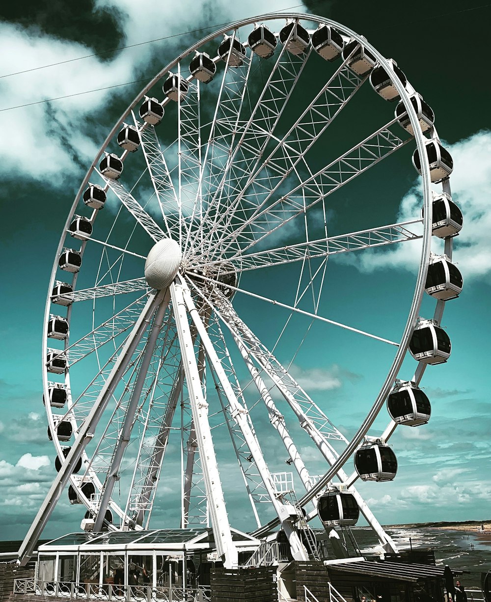 low angle photo of white and black Ferries wheel during daytime