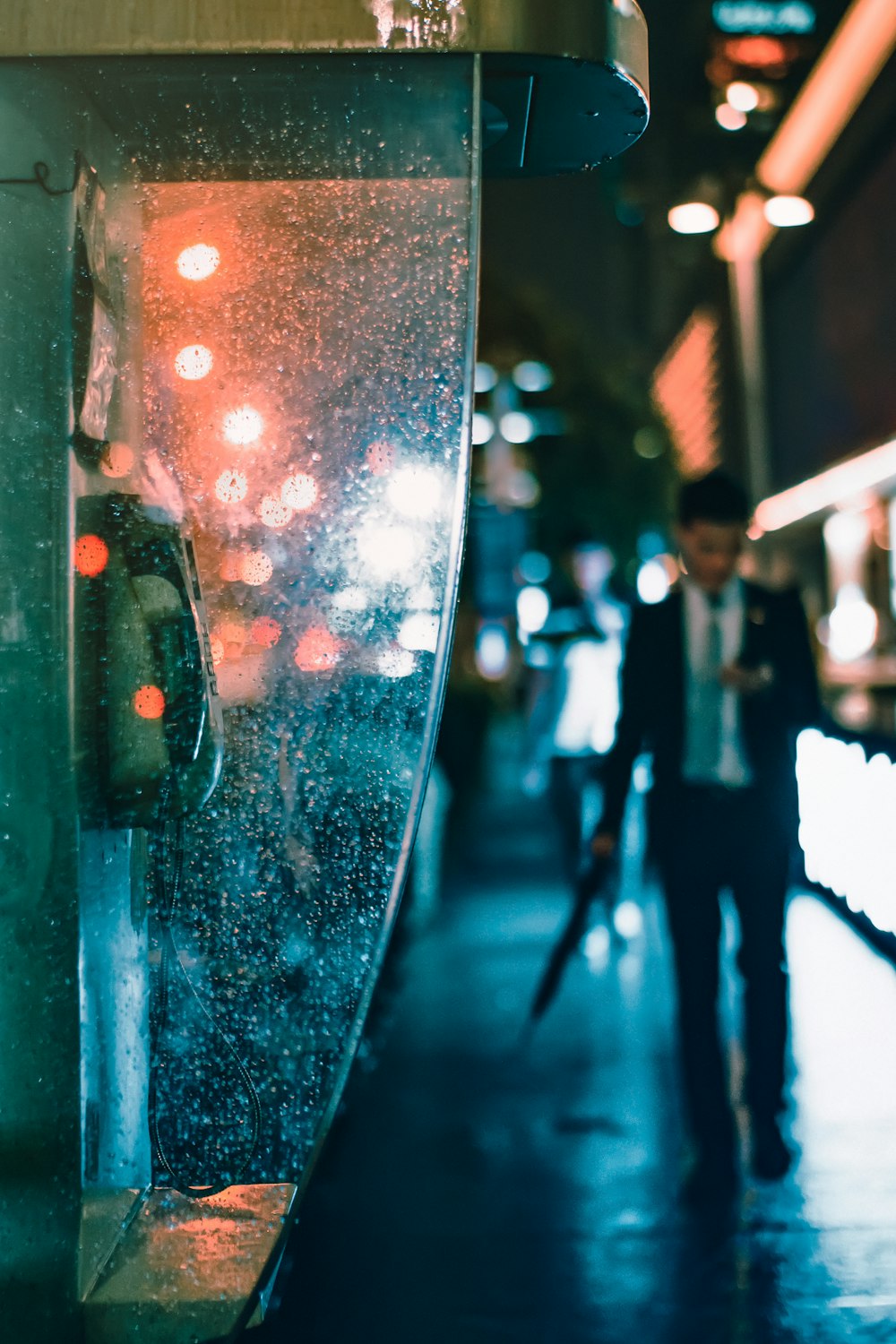 man walking near telephone