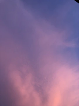 Soft gradient of ocean blues blending into a calm sky