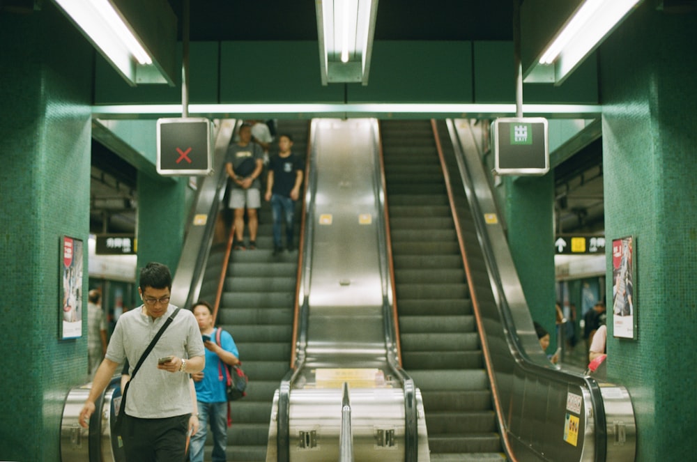 people near escalator