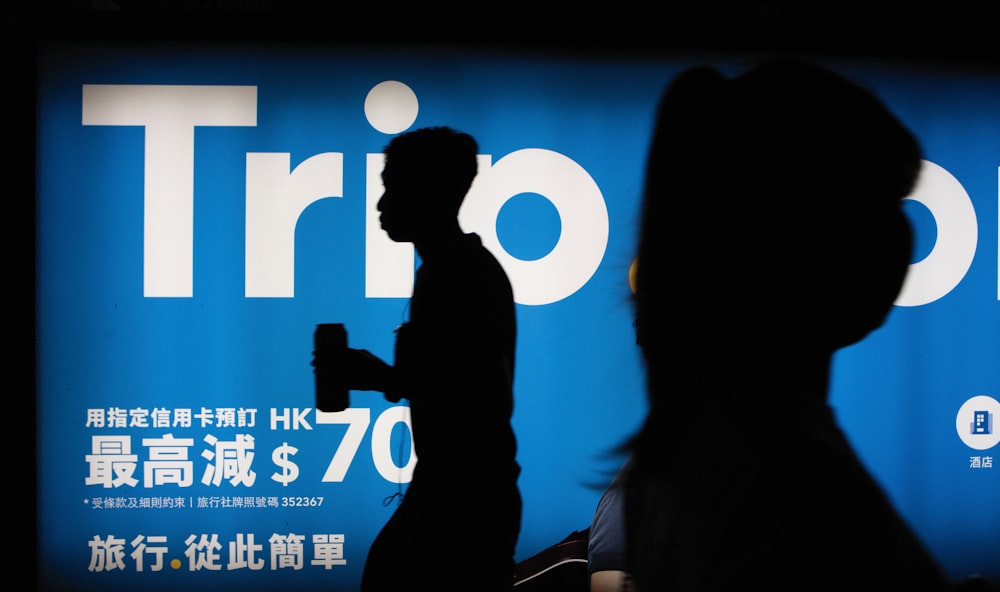 silhouette of person in front of signage