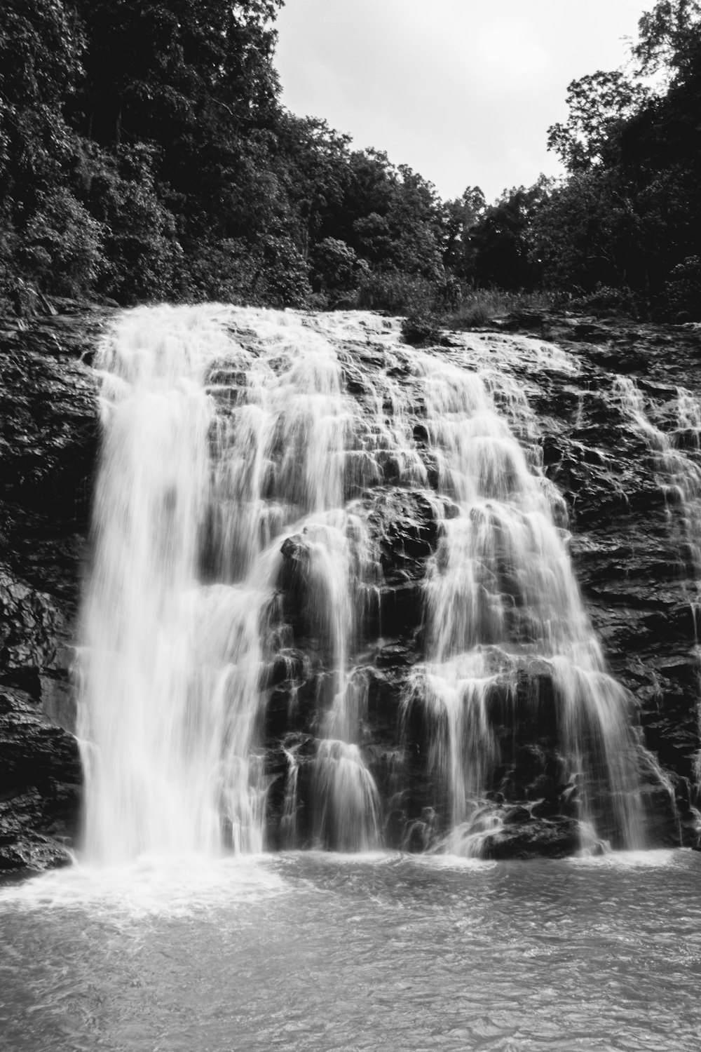 grayscale photo of waterfalls