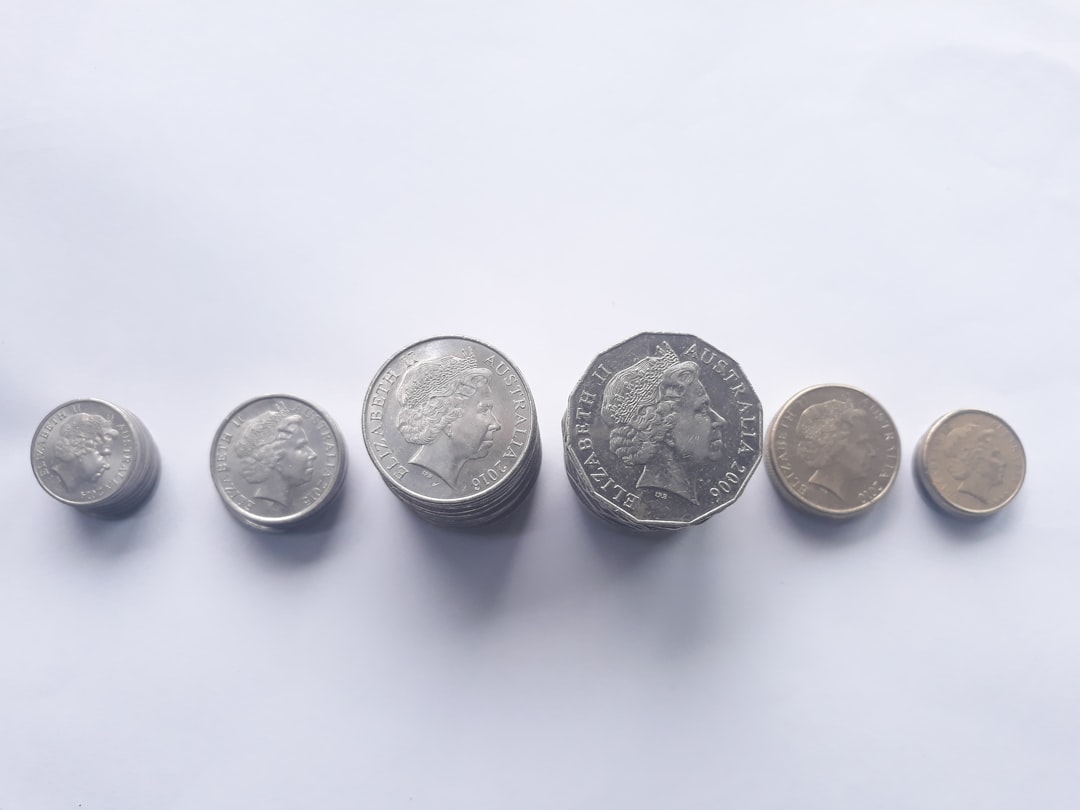 round silver-colored coin,