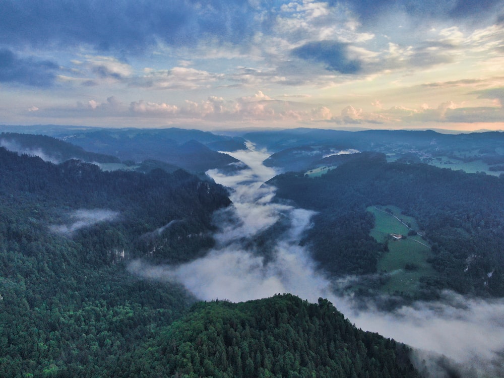 clouds forming at the mountains during daytime