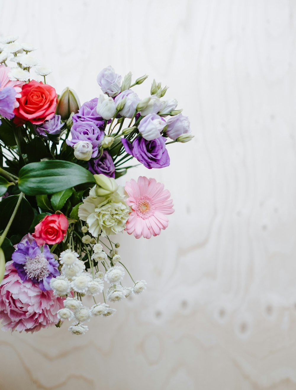 a bunch of flowers that are in a vase