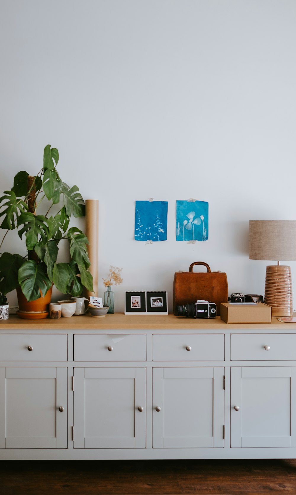 brown table lamp near green plants