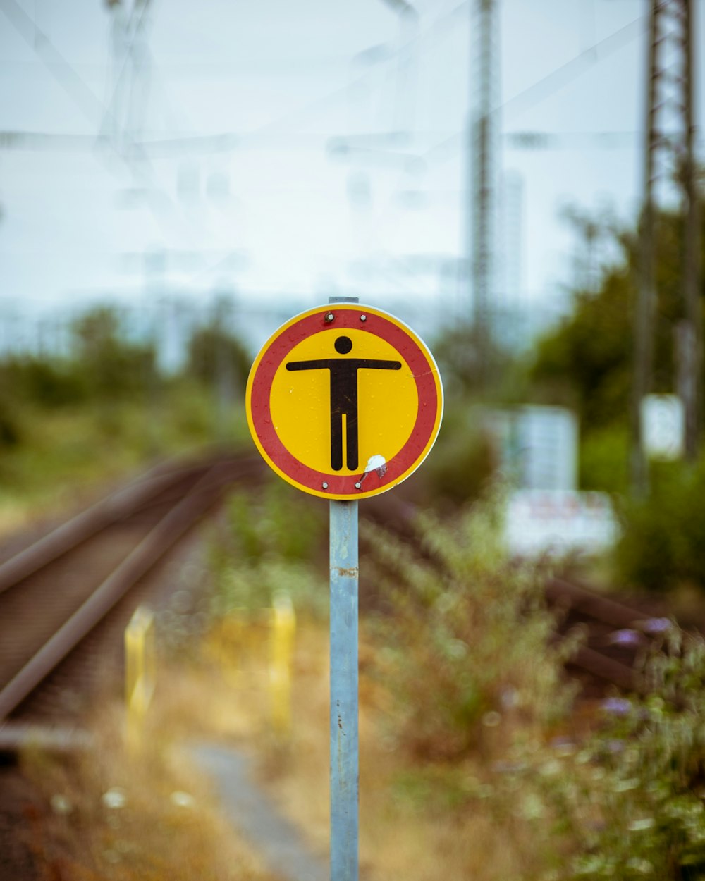 round yellow and black signage during daytime