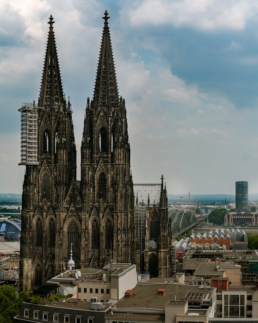 brown concrete building under cloudy sky during daytime, cologne cathedral