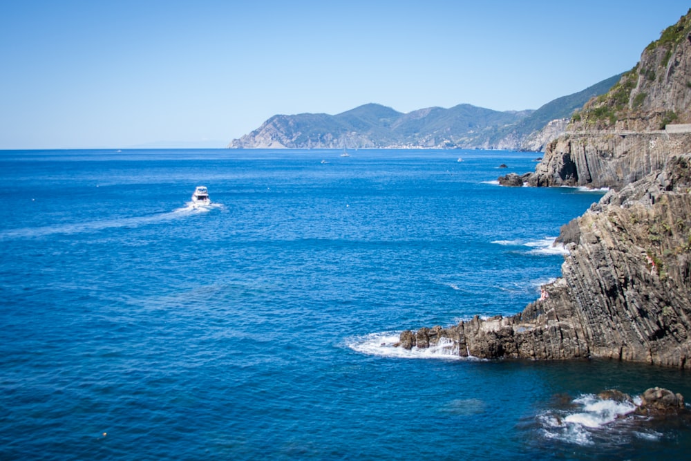 aerial photo of cliff and ocean during daytime