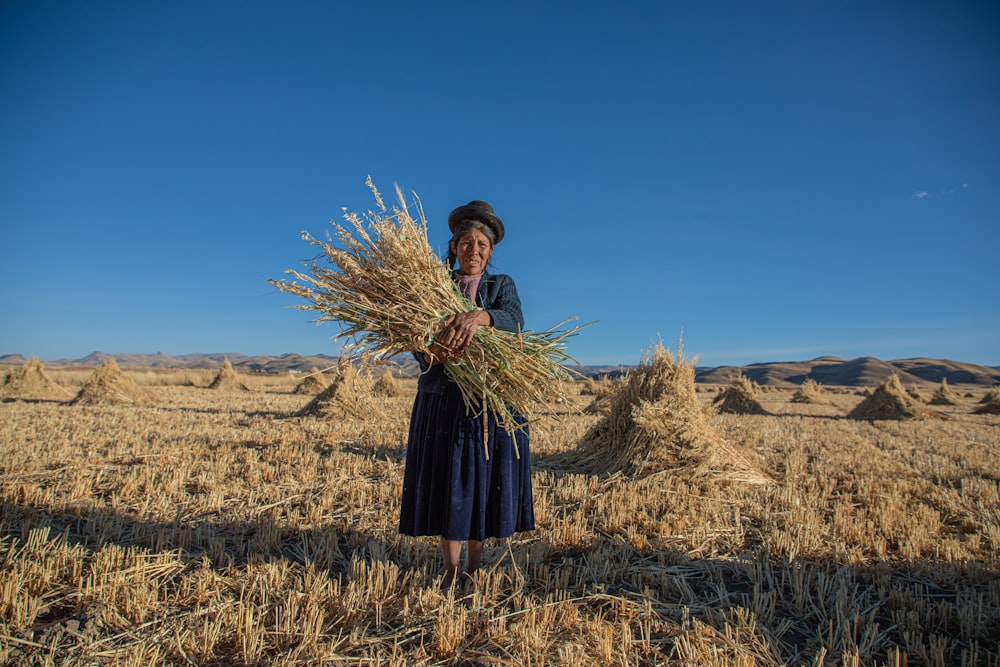 woman holding hay